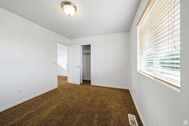 13708 S Manas Ct, Herriman, UT 84096 - unfurnished bedroom with carpet flooring, a closet, and baseboards