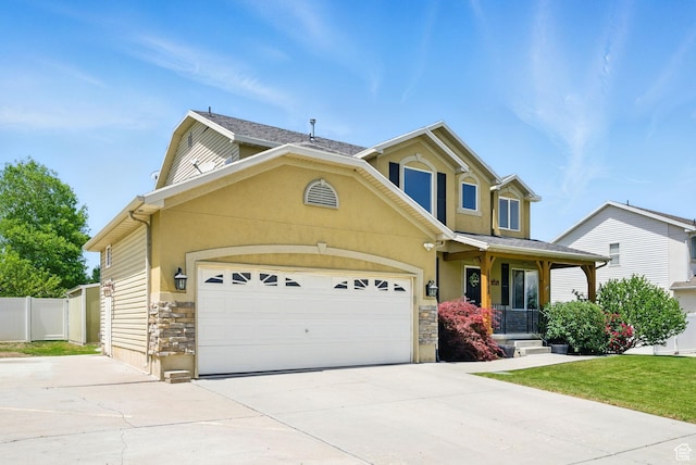 13708 S Manas Ct, Herriman, UT 84096 - traditional-style home featuring stone siding, driveway, a garage, covered porch, and stucco siding