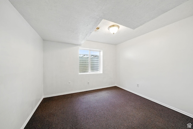 13708 S Manas Ct, Herriman, UT 84096 - empty room featuring baseboards, dark carpet, and a textured ceiling