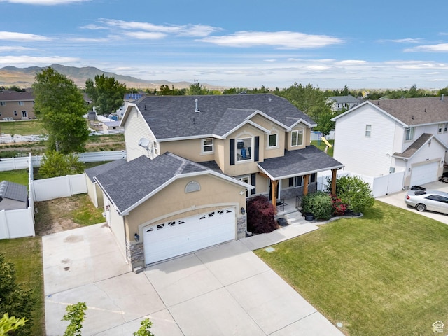 13708 S Manas Ct, Herriman, UT 84096 - traditional-style home featuring stucco siding, stone siding, a residential view, concrete driveway, and a garage
