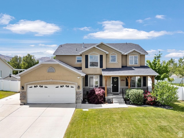 13708 S Manas Ct, Herriman, UT 84096 - view of front of home with stucco siding, concrete driveway, an attached garage, and stone siding