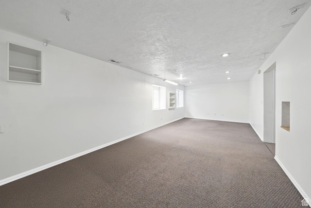 13708 S Manas Ct, Herriman, UT 84096 - basement featuring carpet flooring, a textured ceiling, baseboards, and recessed lighting