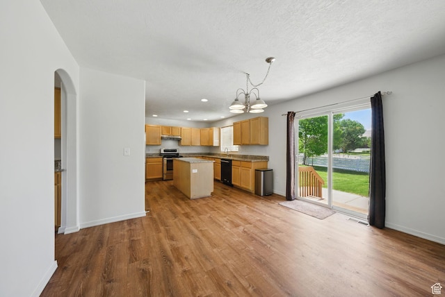 13708 S Manas Ct, Herriman, UT 84096 - kitchen featuring stainless steel stove, dishwasher, arched walkways, light wood-type flooring, and a chandelier