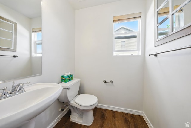 13708 S Manas Ct, Herriman, UT 84096 - bathroom with toilet, wood finished floors, plenty of natural light, and baseboards