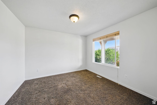 13708 S Manas Ct, Herriman, UT 84096 - spare room featuring dark carpet and baseboards