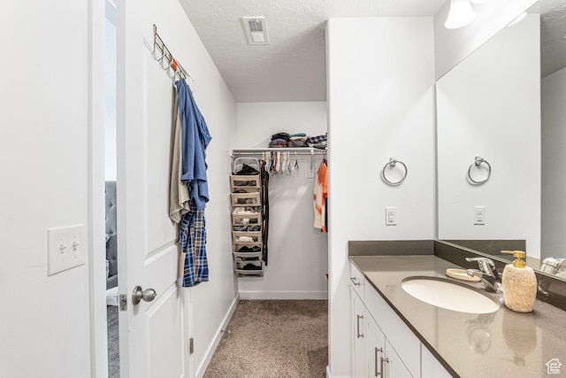 3970 W Cool Spring Ave, Lehi, UT 84043 - bathroom featuring vanity, a spacious closet, and baseboards