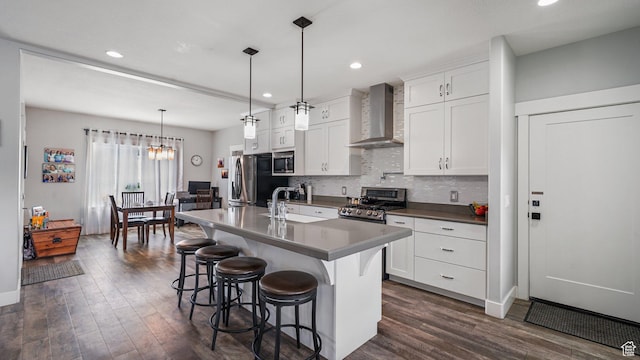 225 W 1390 N, Orem, UT 84057 - kitchen featuring wall chimney exhaust hood, stainless steel appliances, a sink, dark wood-style flooring, and recessed lighting