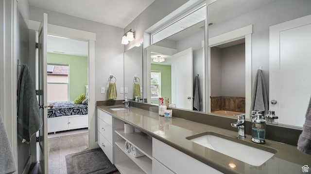 225 W 1390 N, Orem, UT 84057 - bathroom with healthy amount of natural light, double vanity, a bath, and wood finished floors