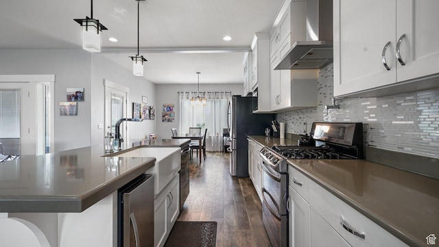 225 W 1390 N, Orem, UT 84057 - kitchen with appliances with stainless steel finishes, wall chimney exhaust hood, a sink, dark wood-type flooring, and decorative backsplash