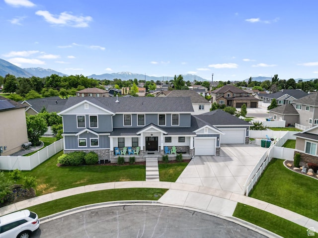 225 W 1390 N, Orem, UT 84057 - view of front of property featuring a residential view, concrete driveway, stone siding, a mountain view, and an attached garage
