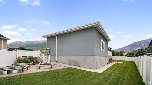 225 W 1390 N, Orem, UT 84057 - rear view of house with a garden, a mountain view, and stucco siding