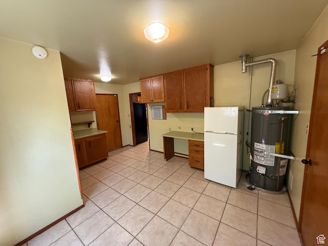 1144 W Bloomington Dr S, St George, UT 84790 - kitchen featuring freestanding refrigerator, water heater, light tile patterned floors, brown cabinets, and light countertops