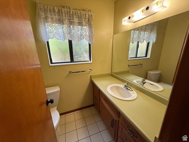 1144 W Bloomington Dr S, St George, UT 84790 - bathroom with toilet, tile patterned flooring, vanity, and baseboards