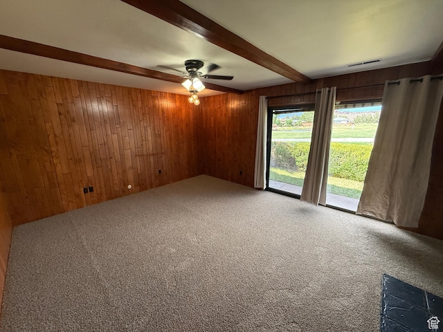 1144 W Bloomington Dr S, St George, UT 84790 - spare room with wooden walls, beam ceiling, carpet flooring, and ceiling fan