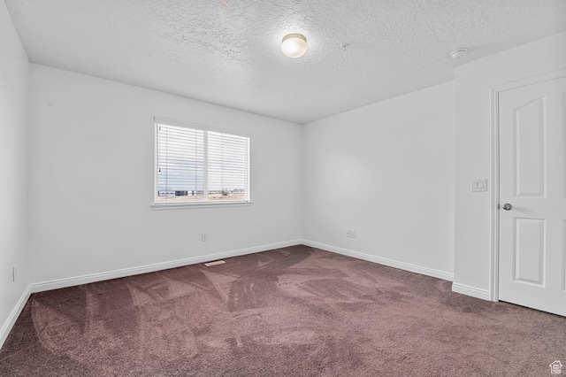 4699 W Greensand Dr S, West Jordan, UT 84084 - spare room with dark colored carpet, a textured ceiling, and baseboards