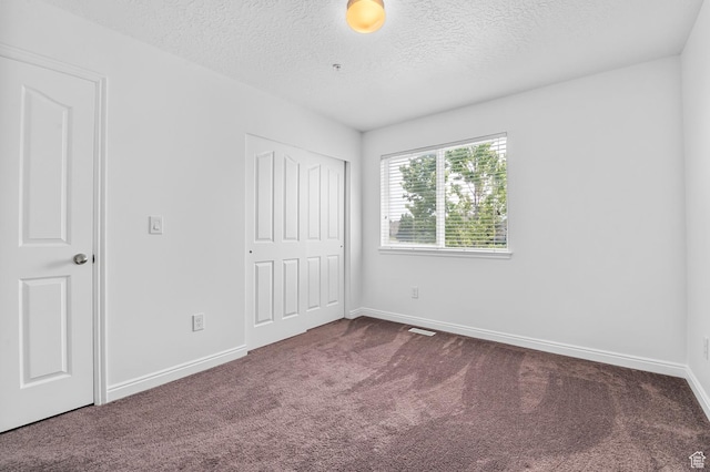 4699 W Greensand Dr S, West Jordan, UT 84084 - unfurnished bedroom with carpet, a textured ceiling, a closet, and baseboards
