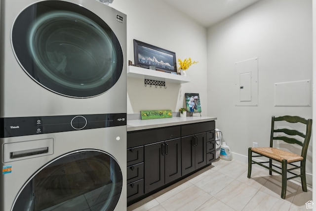2711 S 500 E, Francis, UT 84036 - laundry area featuring stacked washer / drying machine, electric panel, cabinet space, light tile patterned flooring, and baseboards
