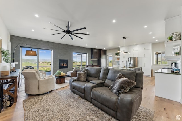 2711 S 500 E, Francis, UT 84036 - living area with ceiling fan, recessed lighting, a large fireplace, and light wood-type flooring