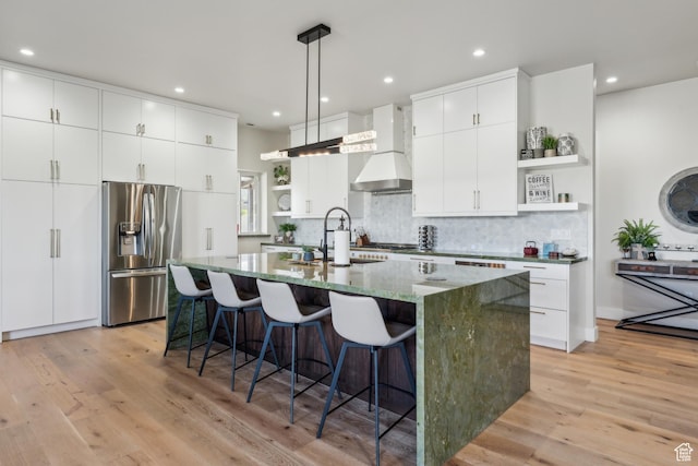2711 S 500 E, Francis, UT 84036 - kitchen with stainless steel fridge with ice dispenser, open shelves, wall chimney range hood, a sink, and tasteful backsplash