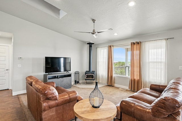 48 S Cimarron Cir, Cedar City, UT 84720 - living area with baseboards, a wood stove, recessed lighting, a ceiling fan, and light wood finished floors
