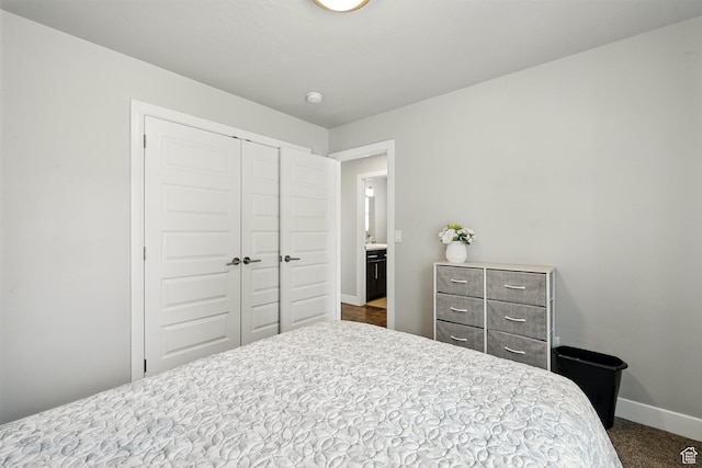 48 S Cimarron Cir, Cedar City, UT 84720 - bedroom featuring a closet, baseboards, and dark colored carpet