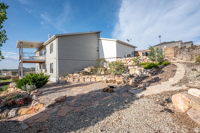 48 S Cimarron Cir, Cedar City, UT 84720 - view of side of home with a balcony and stucco siding