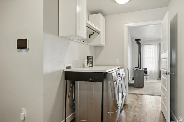 48 S Cimarron Cir, Cedar City, UT 84720 - laundry area featuring cabinet space, hardwood / wood-style flooring, and washing machine and dryer