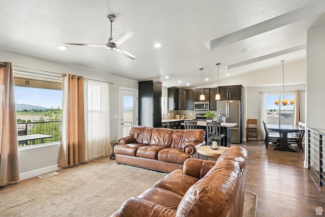 48 S Cimarron Cir, Cedar City, UT 84720 - living area featuring vaulted ceiling, plenty of natural light, recessed lighting, ceiling fan, and dark wood finished floors