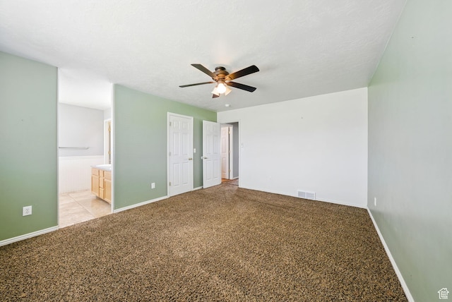 1826 N 2600 W, Lehi, UT 84043 - unfurnished bedroom featuring connected bathroom, baseboards, light carpet, and ceiling fan