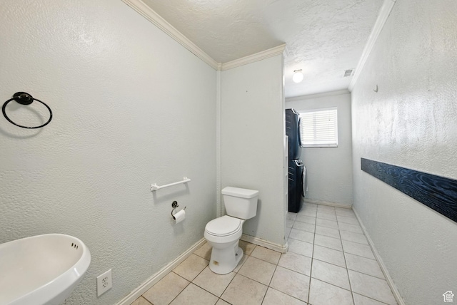1826 N 2600 W, Lehi, UT 84043 - bathroom featuring crown molding, tile patterned floors, toilet, a textured ceiling, and baseboards