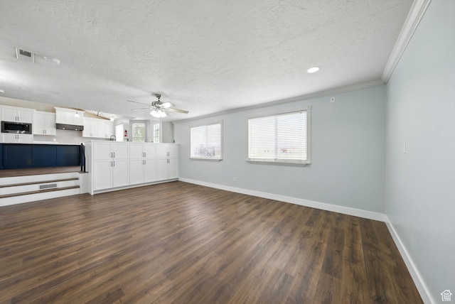 1826 N 2600 W, Lehi, UT 84043 - unfurnished living room with baseboards, a textured ceiling, dark wood-type flooring, a ceiling fan, and crown molding
