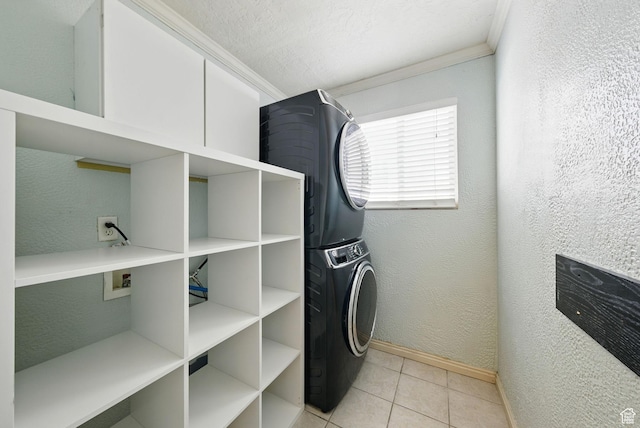 1826 N 2600 W, Lehi, UT 84043 - laundry area featuring stacked washer / drying machine, baseboards, ornamental molding, light tile patterned flooring, and a textured wall