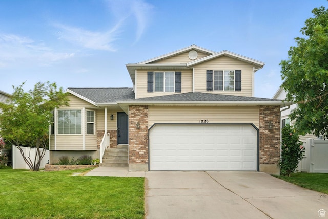 1826 N 2600 W, Lehi, UT 84043 - view of front facade featuring an attached garage, driveway, and brick siding
