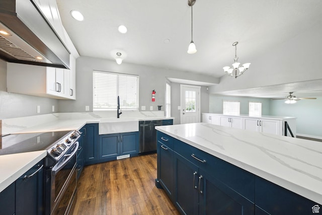 1826 N 2600 W, Lehi, UT 84043 - kitchen featuring blue cabinets, wall chimney range hood, range with electric cooktop, a sink, and dark wood-style flooring