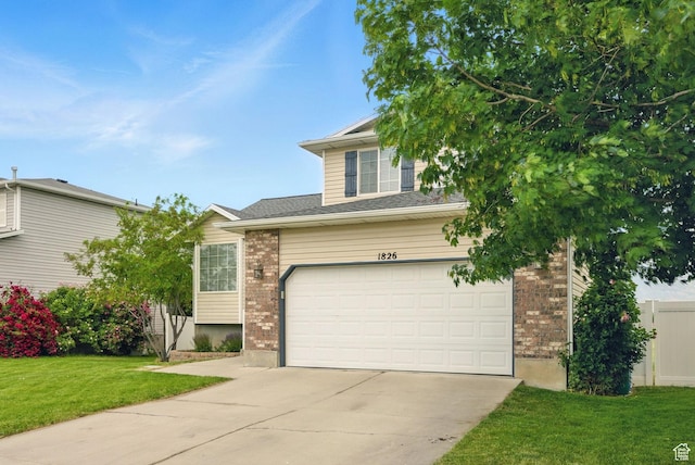 1826 N 2600 W, Lehi, UT 84043 - view of front of property with concrete driveway, a front yard, brick siding, and a garage