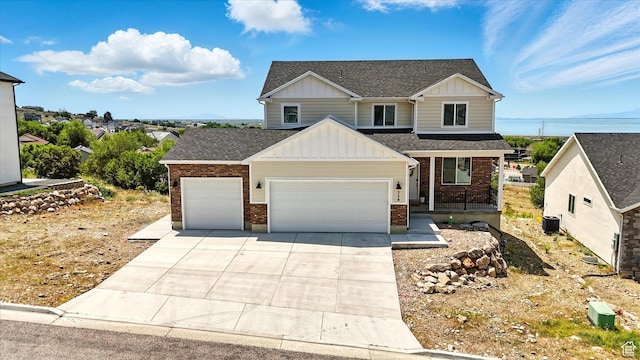 228 E 600 S, Willard, UT 84340 - craftsman inspired home featuring board and batten siding, a garage, brick siding, and concrete driveway