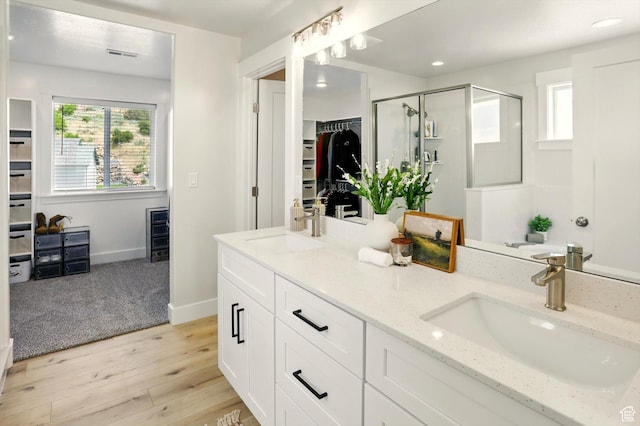228 E 600 S, Willard, UT 84340 - full bathroom featuring a shower stall, a spacious closet, wood finished floors, double vanity, and recessed lighting