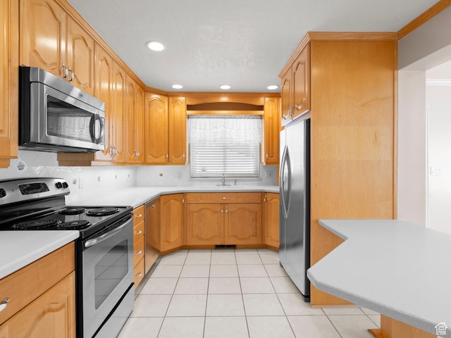 9751 S Garnet Dr, Sandy, UT 84094 - kitchen with stainless steel appliances, recessed lighting, backsplash, light countertops, and a sink