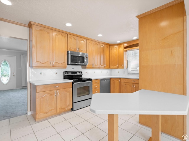 9751 S Garnet Dr, Sandy, UT 84094 - kitchen with appliances with stainless steel finishes, light countertops, light tile patterned floors, recessed lighting, and light colored carpet