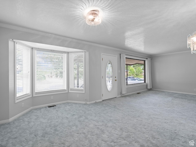 9751 S Garnet Dr, Sandy, UT 84094 - foyer featuring ornamental molding, a textured ceiling, carpet, and baseboards