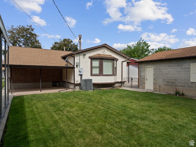 9751 S Garnet Dr, Sandy, UT 84094 - back of house with a patio area, central AC unit, and roof with shingles