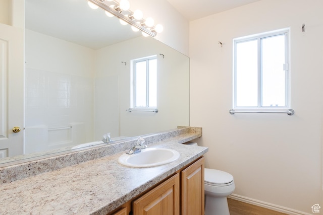 710 S Indian Hills Dr # 64, St George, UT 84770 - full bath with vanity, toilet, wood finished floors, baseboards, and a shower
