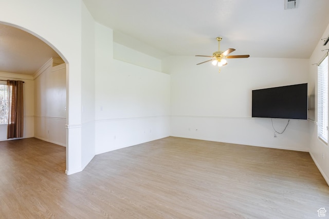 710 S Indian Hills Dr # 64, St George, UT 84770 - unfurnished living room with arched walkways, a ceiling fan, healthy amount of natural light, light wood-style flooring, and lofted ceiling