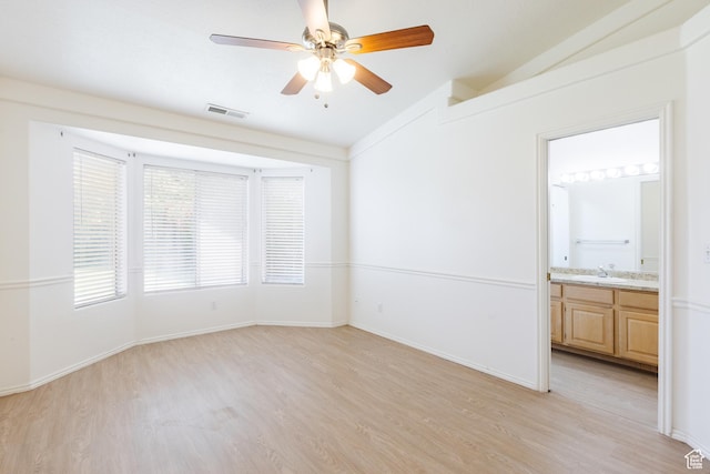 710 S Indian Hills Dr # 64, St George, UT 84770 - unfurnished room with vaulted ceiling, light wood finished floors, a ceiling fan, a sink, and baseboards