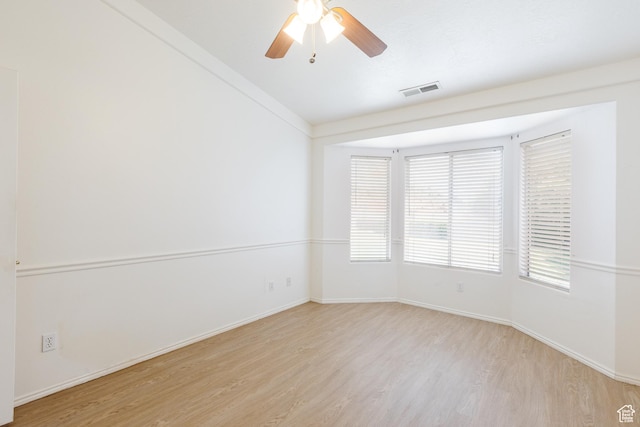 710 S Indian Hills Dr # 64, St George, UT 84770 - unfurnished room featuring light wood finished floors, baseboards, and a ceiling fan
