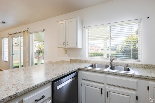 710 S Indian Hills Dr # 64, St George, UT 84770 - kitchen with a sink, stainless steel dishwasher, white cabinetry, and light countertops