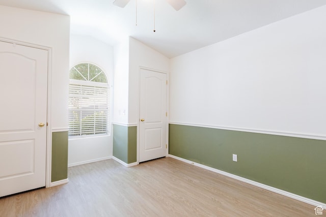 710 S Indian Hills Dr # 64, St George, UT 84770 - unfurnished room with wood finished floors, vaulted ceiling, ceiling fan, and baseboards