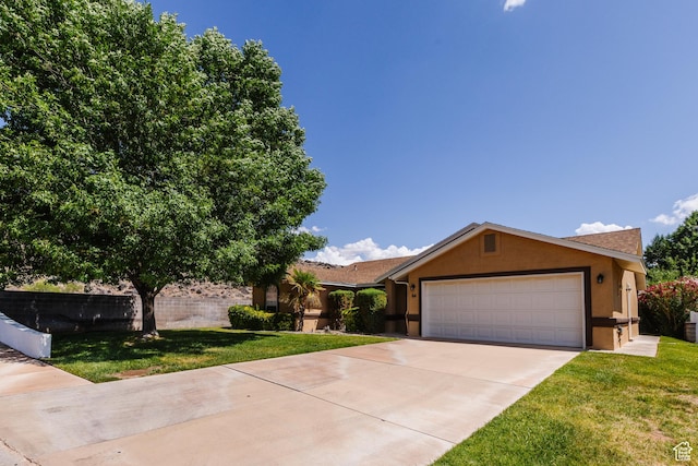 710 S Indian Hills Dr # 64, St George, UT 84770 - ranch-style home with stucco siding, concrete driveway, and a front yard