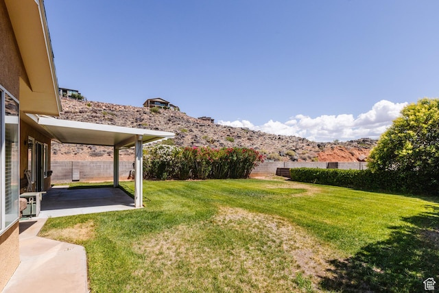 710 S Indian Hills Dr # 64, St George, UT 84770 - view of yard with a patio area and a mountain view