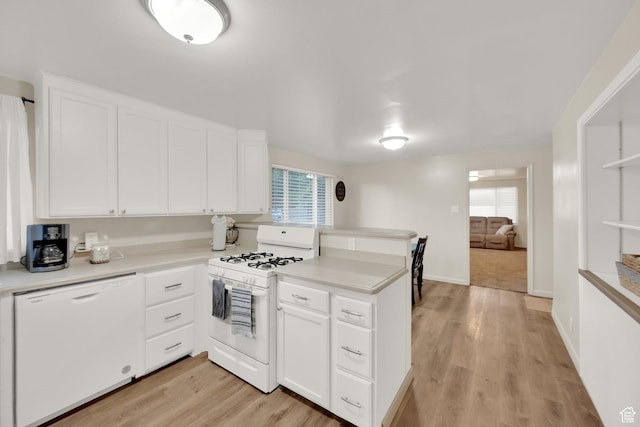 735 W 100 S, Payson, UT 84651 - kitchen with white appliances, a peninsula, white cabinetry, light countertops, and light wood-type flooring